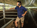 Farmer, headphones, podcast, shed, listening