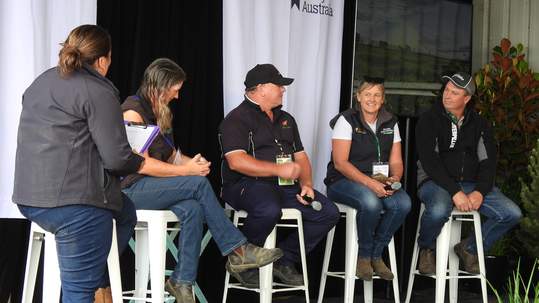 Five panellists sit on stage at the 2024 GippsDairy Muster.