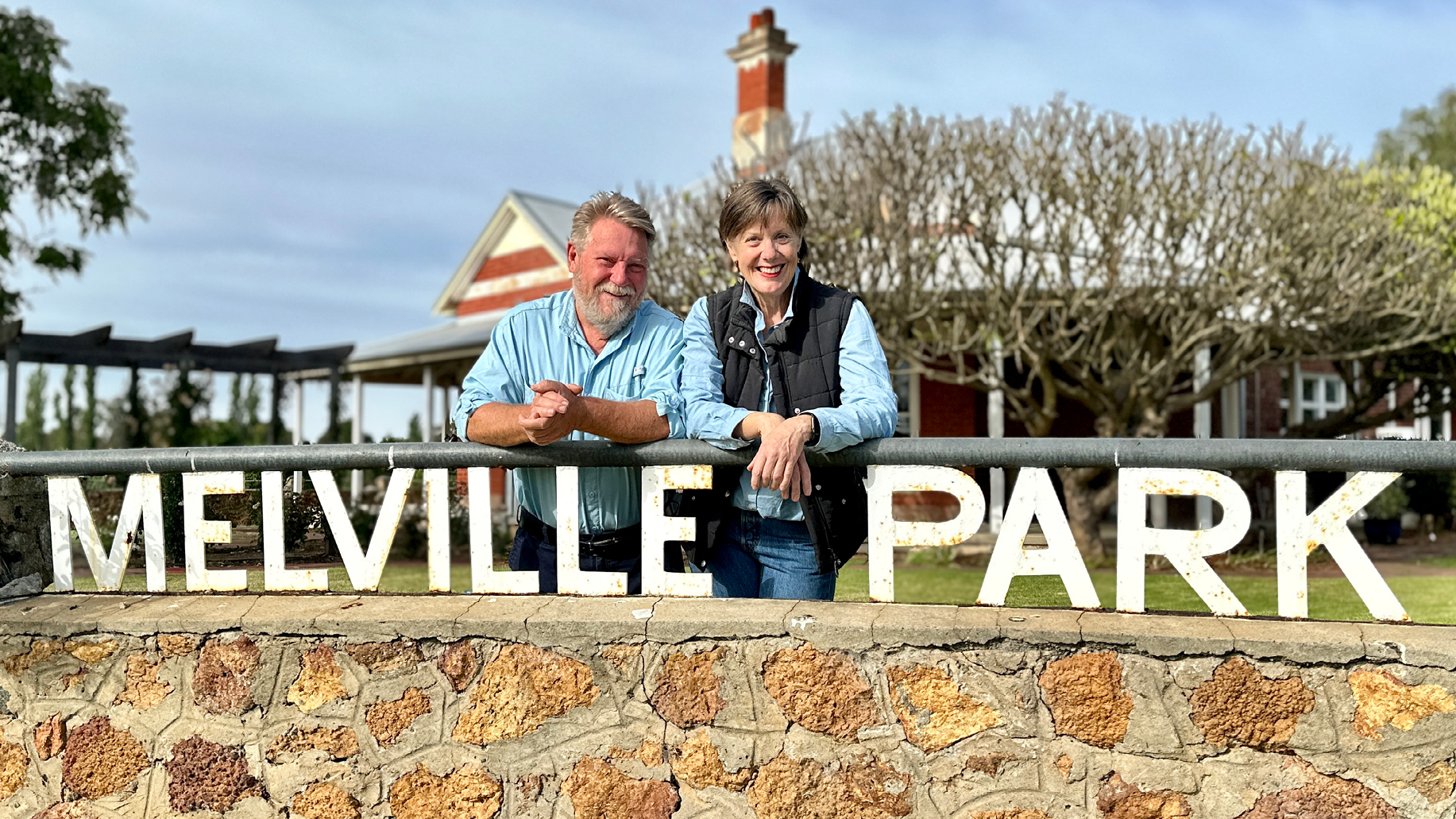 Custodians David and Barbara stand outside the Melville Park homestead.
