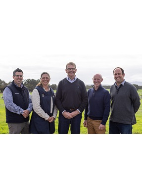 The Western Dairy board standing together outside in a paddock. 